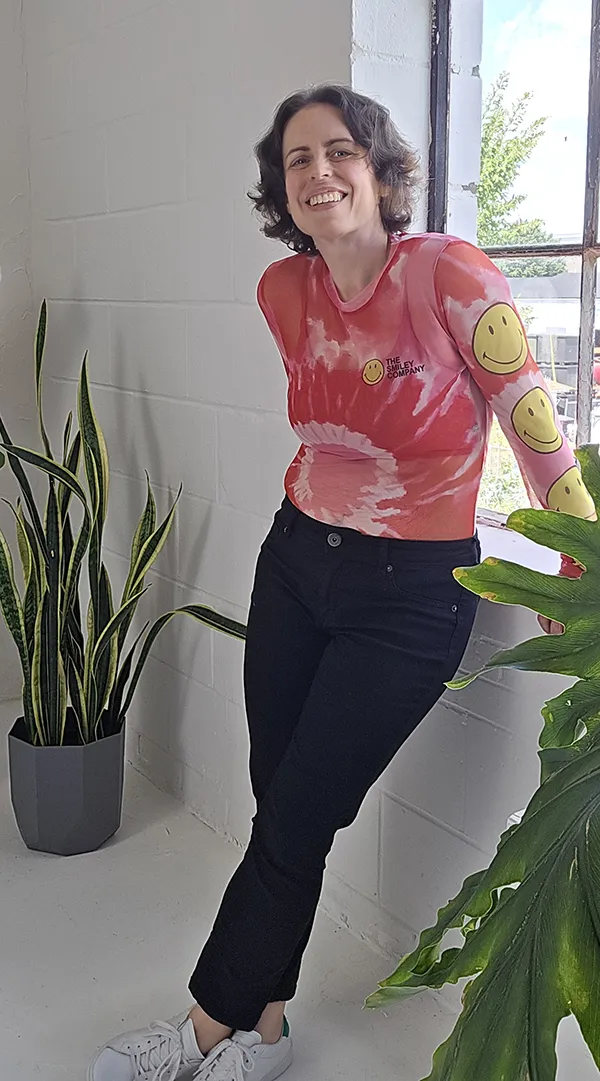Rachel Mik in smilie face shirt
